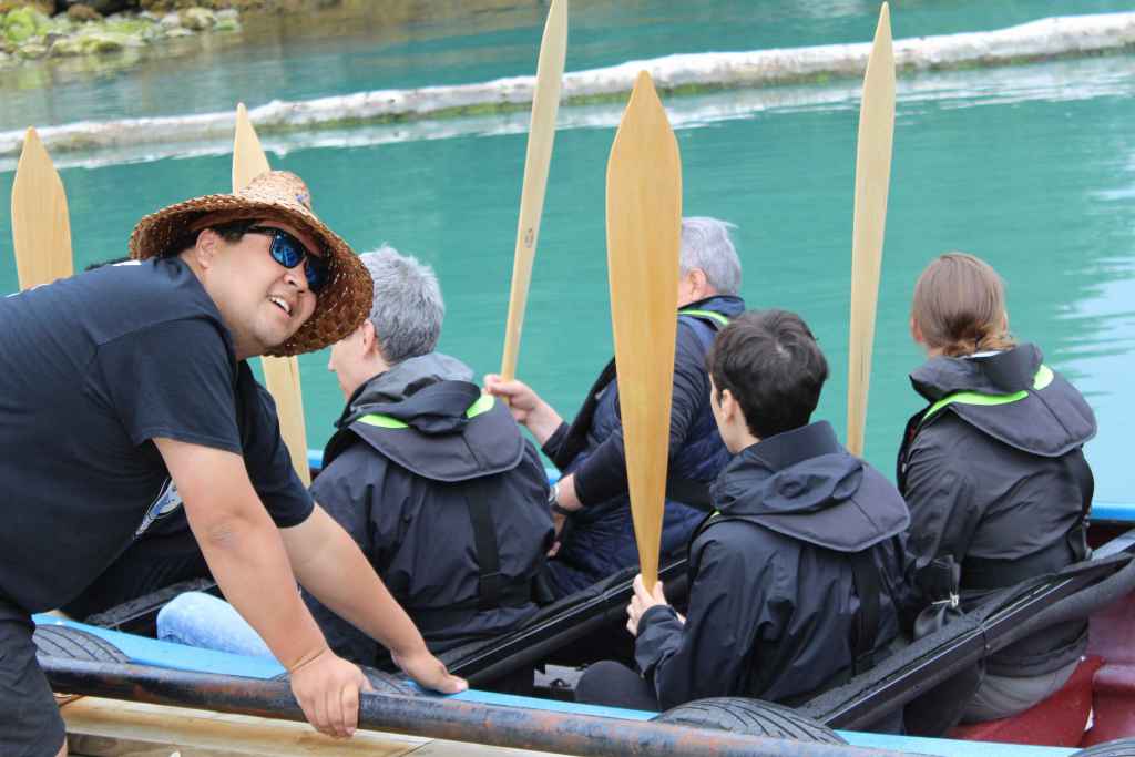 A Homalco youth guides leads a traditional canoe ride as part of a cultural tour. Photo by Meaghan Hume.