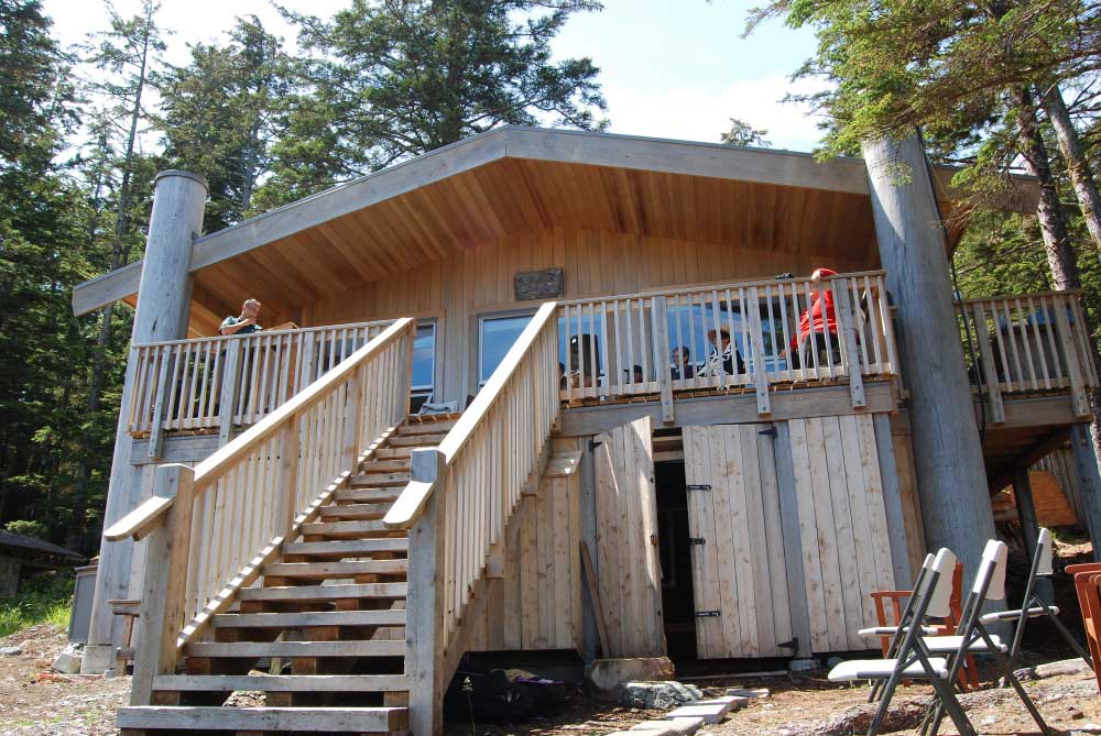 The 1000 sq. foot redwood cedar cabin at SGang Gwaay sits on the same spot as the original cabin.