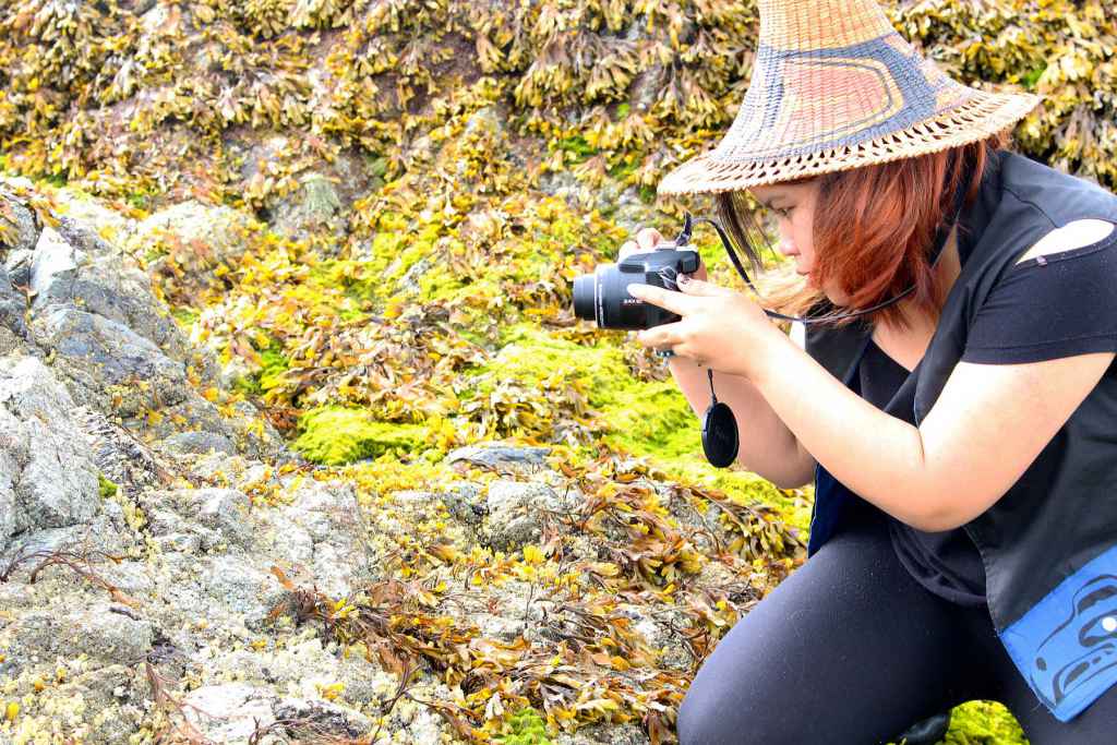 Eliza, 14, photographing creatures of the intertidal zone on Princess Royal Island. 