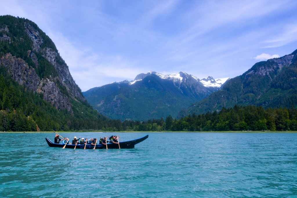 Homalco tour guides greet visitors in a welcome canoe in Bute Inlet. Photo by Tricia Thomas.