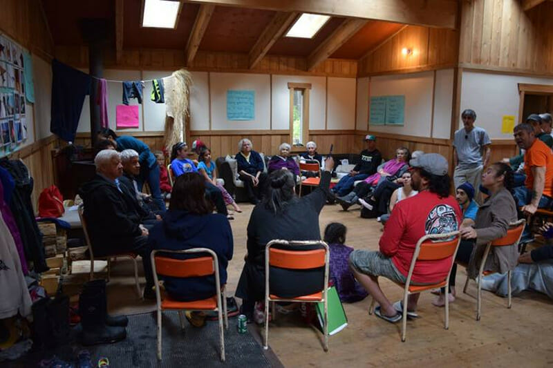 Fluent-speaking Haida elders, actors, and students gathered in the Hiellen Village group longhouse for language training during preparation for a feature film performed entirely in the Haida language. COURTESY OF Haida Laas / Graham Richard