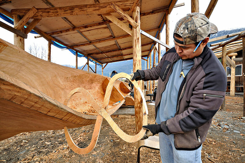 Artists, like this Nisga’a carver are seeing benefits from the increase in tourism in the Nass Valley. Mercer hopes to bring Nisga’a artisans together in a cooperative so visitors can explore their work in one central location. Photo by Gary Fiegehen, Courtesy of Nisga’a Lisims Government.