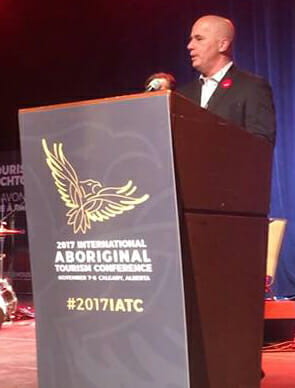 Eric Fenato, current manager at Spirit Bear Lodge, accepts the Indigenous Adventure Award at the Indigenous Tourism Awards. Photo courtesy of Spirit Bear Lodge.