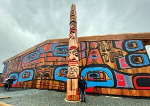 Large wooden building with Heiltsuk paintings of whales, fish, and bears.