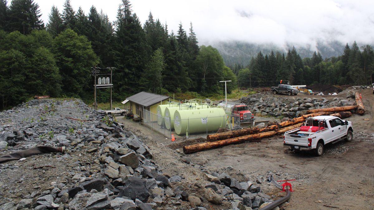 construction of a new hydropower facility alongside diesel tanks and power lines