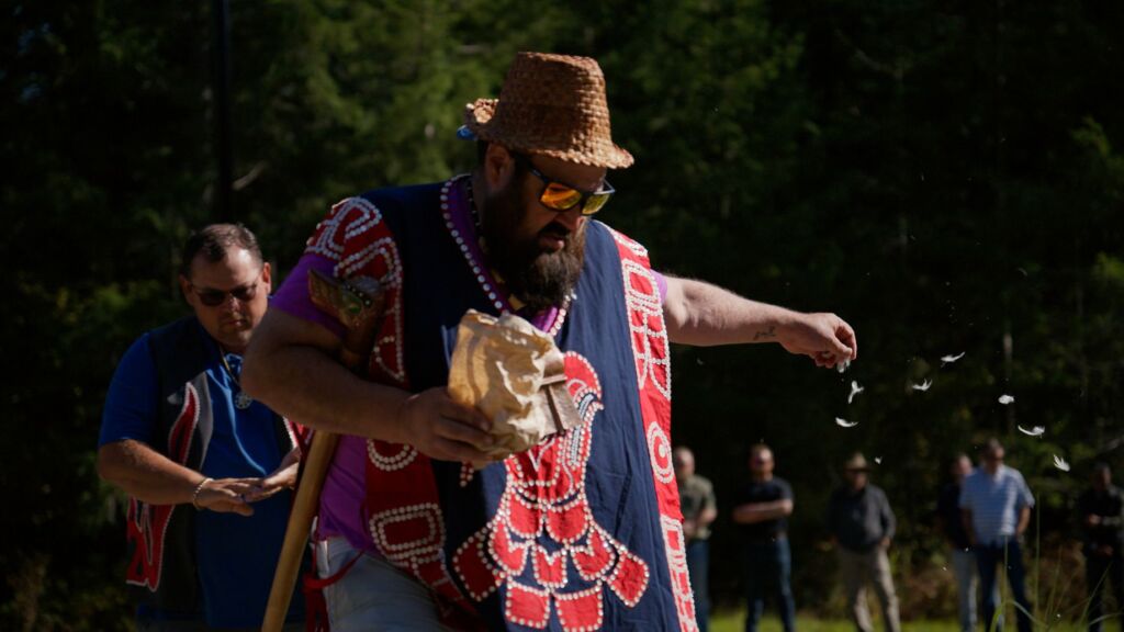 Dallas Smith, Tlowitsis Nation member, Coast Funds' board chair and president of Nanwakolas participating in a blessing ceremony at the entrance of Nenagwas. 
