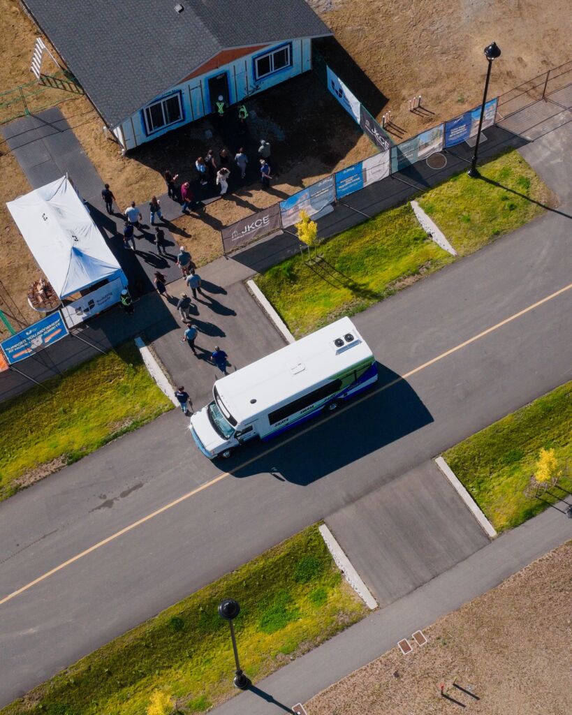 An aerial shot of guests walking into an almost complete home at the Nenagwas village. 