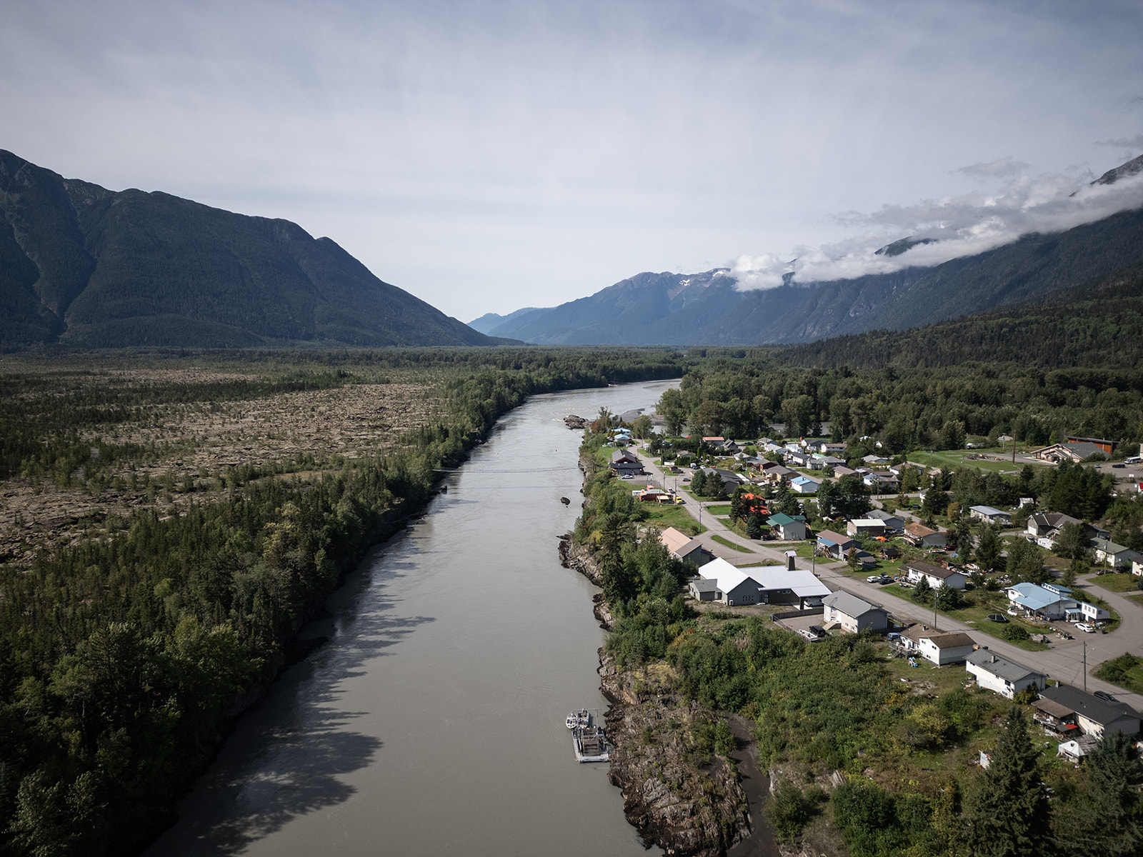 An aerial shot of the Nass River. It separates the village of Gitwinksihlkw (right) from the Nisg̱a’a Memorial Lava Bed Protected Area (left).