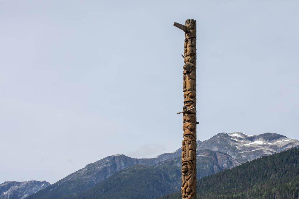 The top half of a totem pole in the village of Gitwinksihlkw.