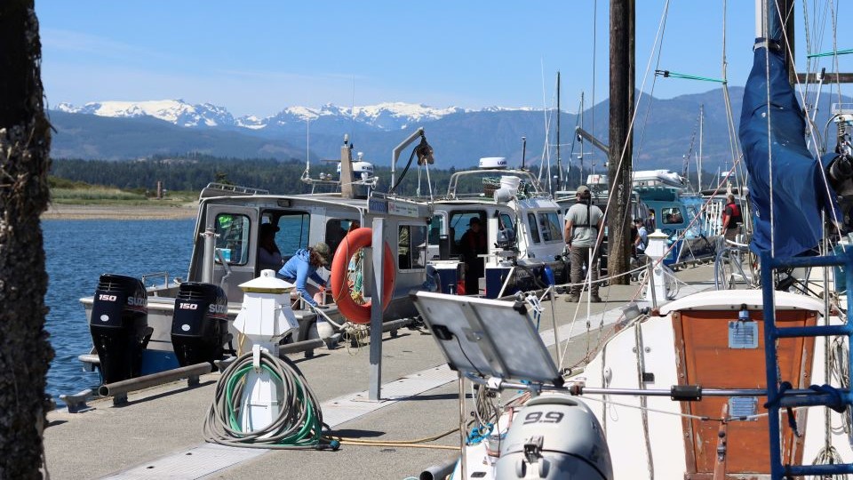 Guardians prepare their marine vessels before conducting emergency response scenarios on the water