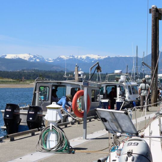 Guardians prepare their marine vessels before conducting emergency response scenarios on the water